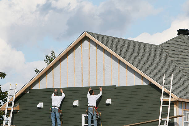 Professional Siding Installation technician working in Franklin Square, NY